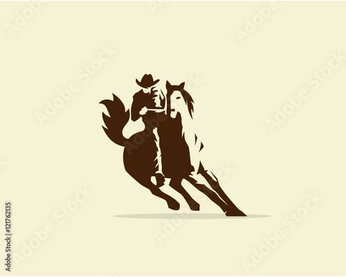 Cowboy riding wild horse