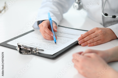 Doctor and patient sitting at the desk