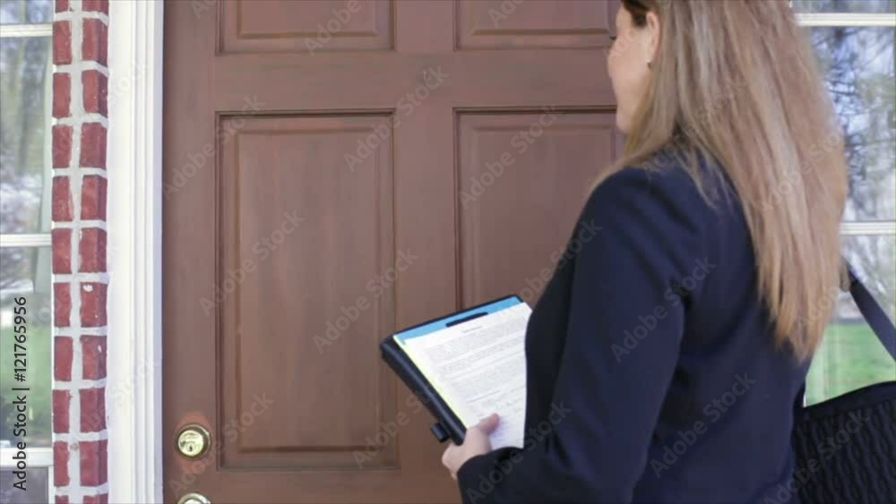 A saleswoman knocks on a door that is opened by an elderly woman and her daughter.
