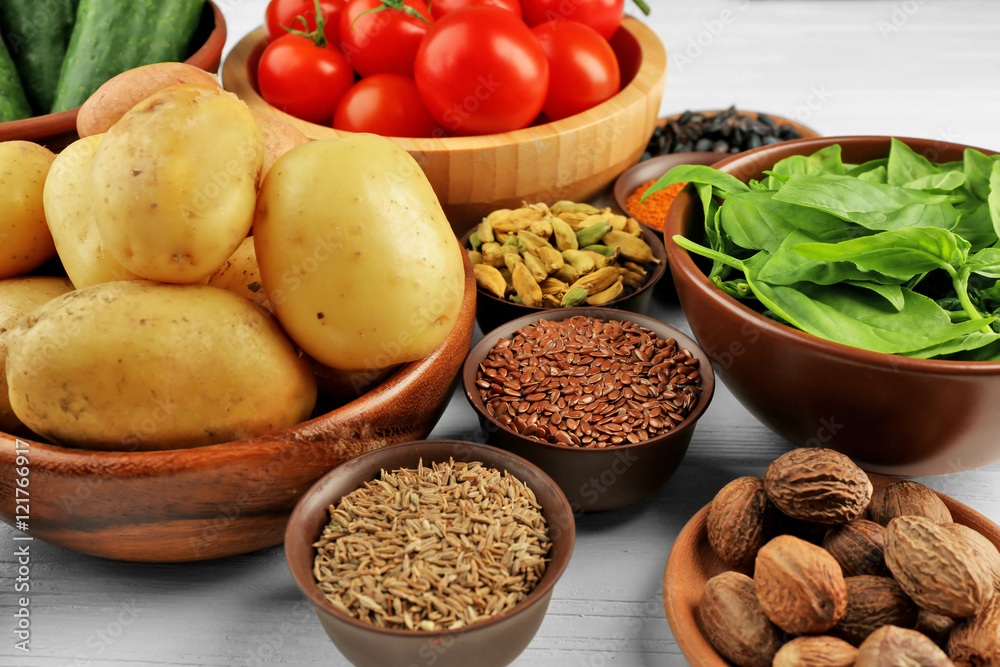 Vegetables and spices on wooden table, closeup Vegetables and spices on wooden table, closeup
