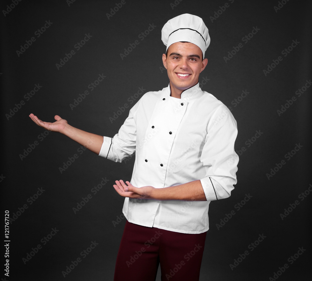 Young handsome chef cook on black background Young handsome chef cook on black background