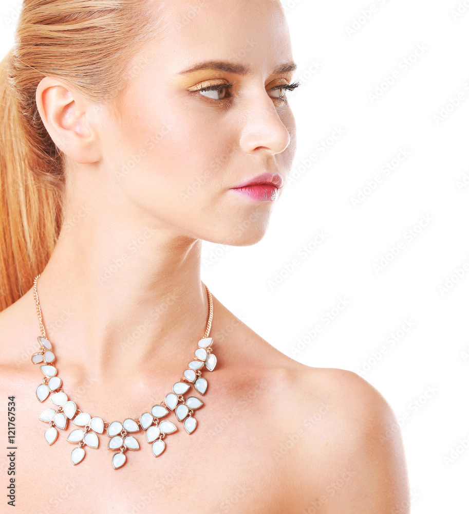 Portrait of attractive woman with beautiful necklace on her neck