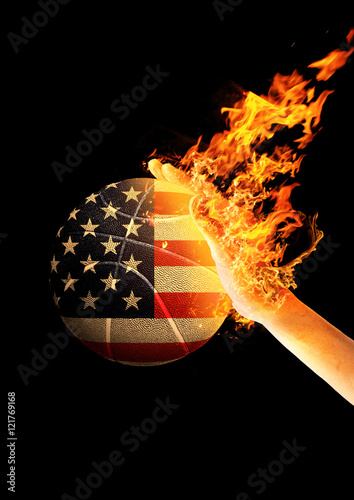 Mão em Chamas arremessando Bola de Basquete pintada com a Bandeira dos Estados Unidos photo