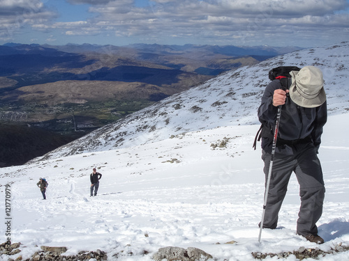 Hiking through the snow on Ben Nevis, Scotland, UK photo