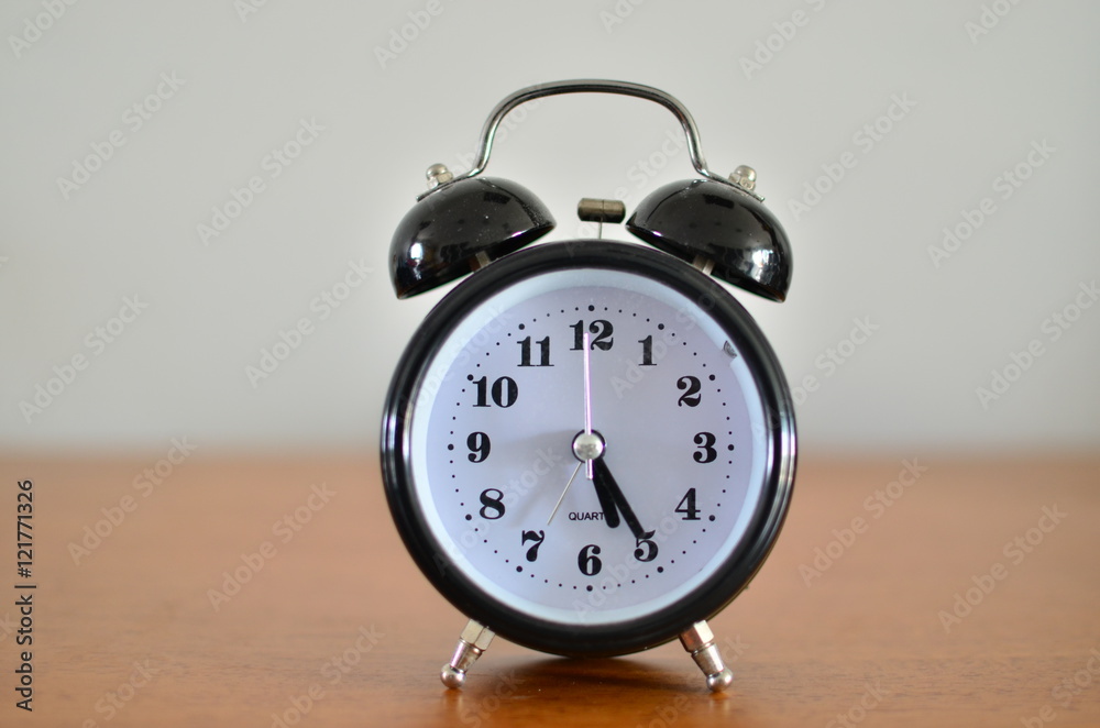 The black alarm clock The black alarm clock