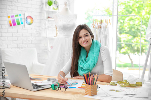Pretty young dress designer...