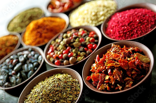 Different spices in bowls, closeup © Africa Studio