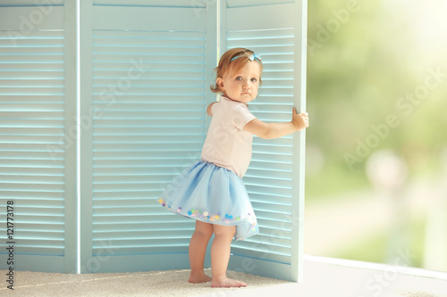 Baby girl in a beautiful dr...