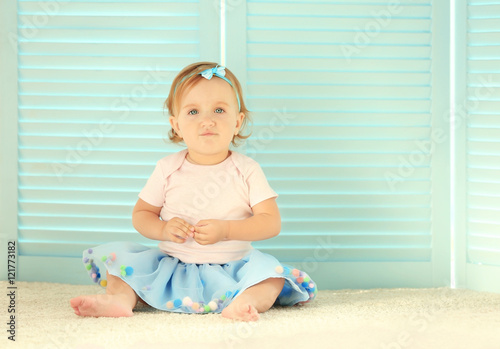 Baby girl in a beautiful dr...