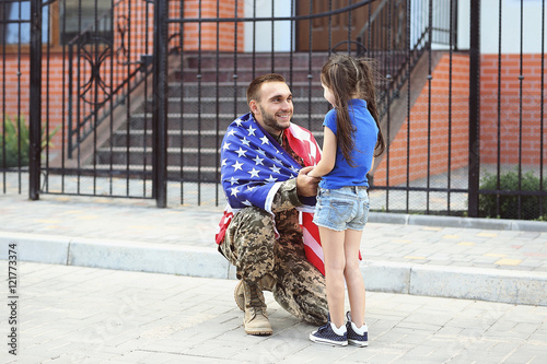 Happy reunion of US army soldier with daughter photo