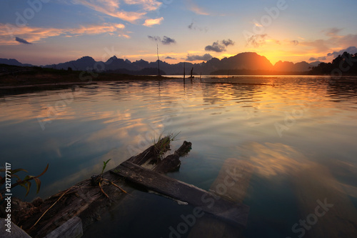 Silhouette scenery during sunrise of lake river at natural attractions in Ratchaprapha Dam at Khao Sok National Park, Surat Thani Province in Thailand. Traveling and recreation Concept