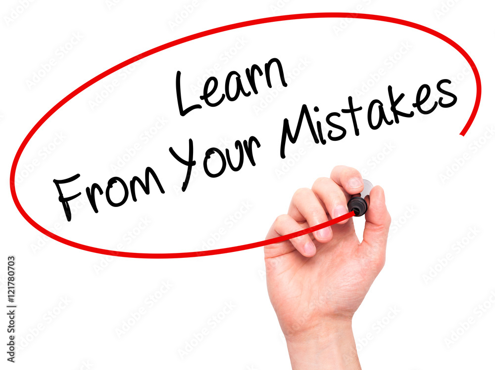 Man Hand writing Learn From Your Mistakes with black marker on Man Hand writing Learn From Your Mistakes with black marker on
