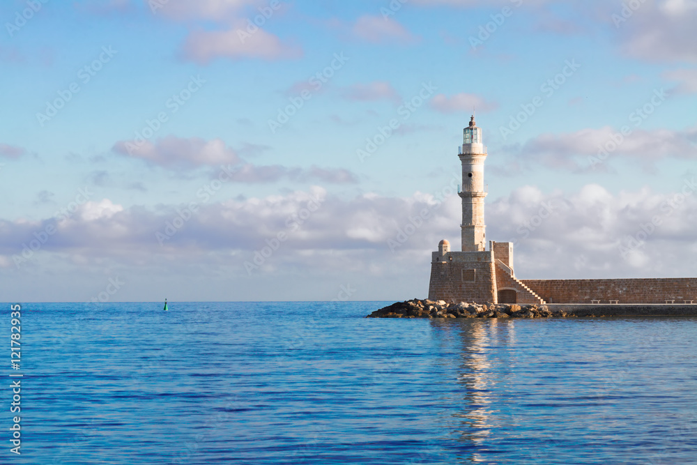bay of Chania with waters of Aegan sea and lighthouse at sunny summer morning, Crete, Greece