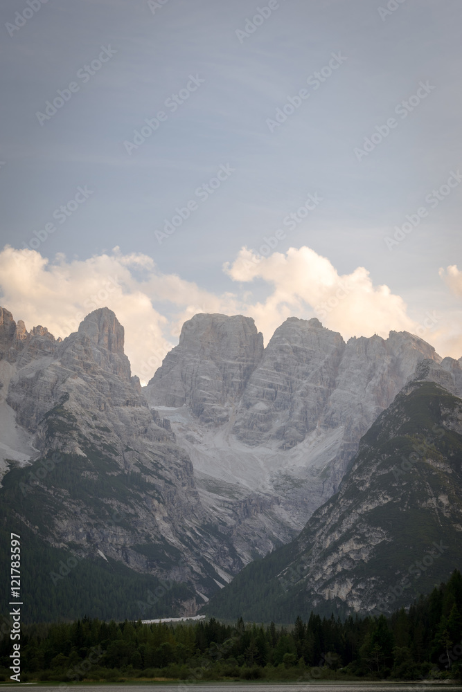 Vertical view of majestic rocky mountains. Picture of valley in Italian Dolomites. UNESCO World Heritage Site.