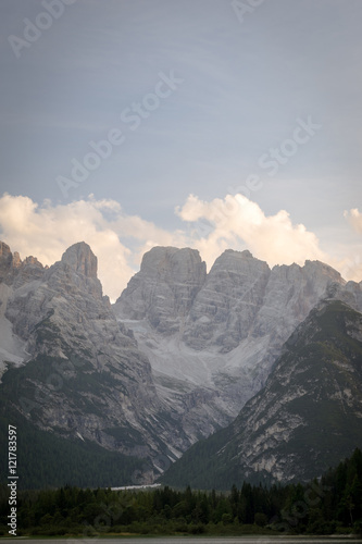 Vertical view of majestic rocky mountains. Picture of valley in Italian Dolomites. UNESCO World Heritage Site.