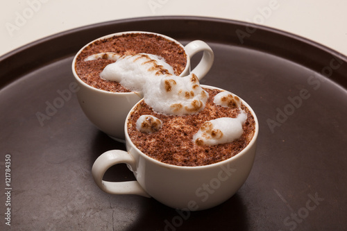 Coffee with foam in the form of cat and mouse