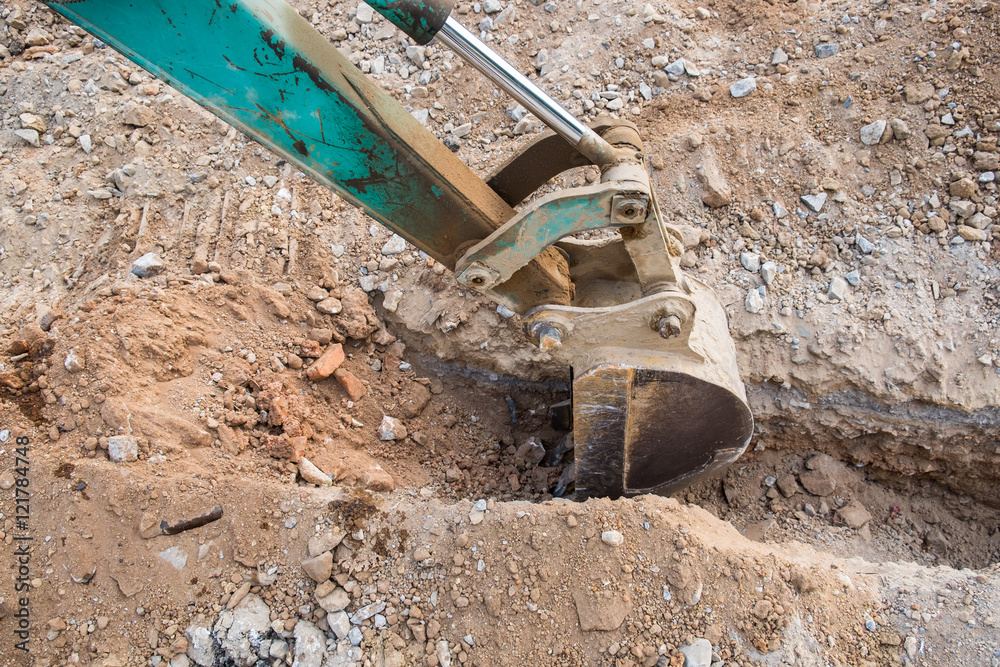 Green backhoe dredging soil
