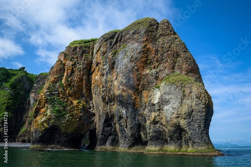 reen rocky cliffs form the coastline of the Avacha Bay, Kamchatka, Russia Fototapeta