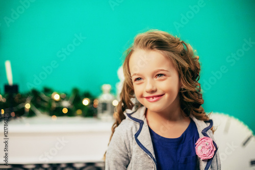 Happy little girl smiling. The concept of the New Year and Merry Christmas.