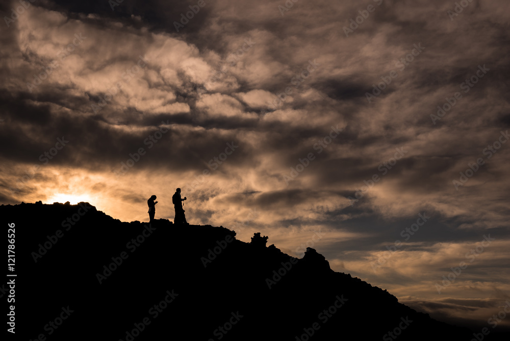 Silhouettes during sunset on the slopes of Tolbachik Volcano, Kamchatka, Russia