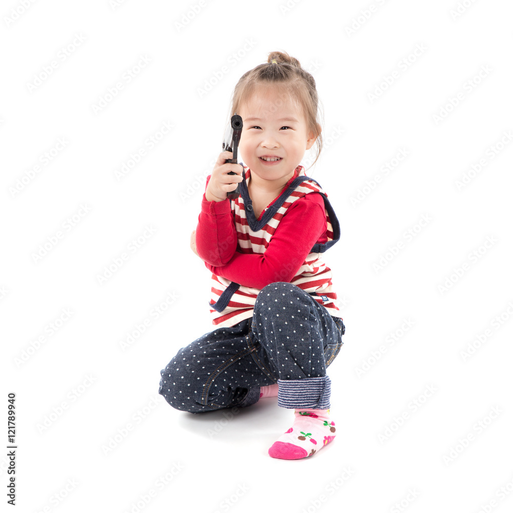 Happy little asian girl with a toy gun on white background Happy little asian girl with a toy gun on white background