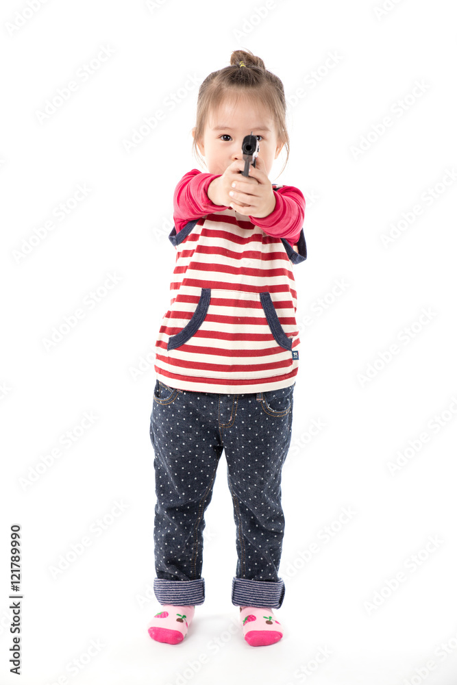 Happy little asian girl with a toy gun on white background Happy little asian girl with a toy gun on white background