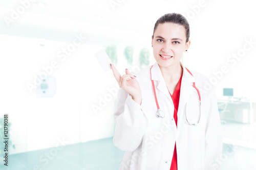 Medical contact concept with woman doctor with card