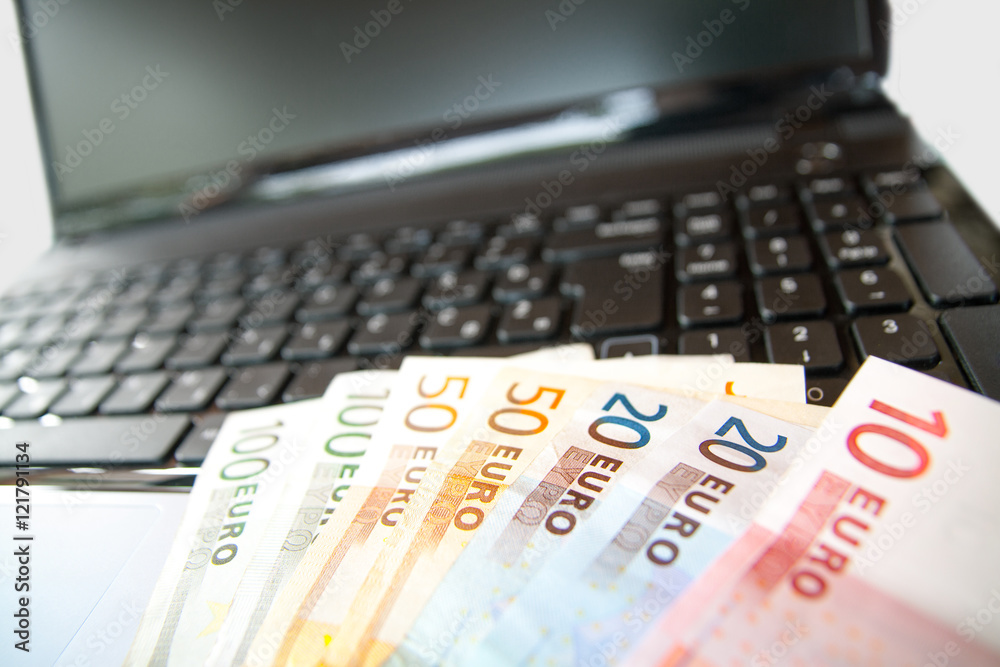 Laptop and money Laptop and money