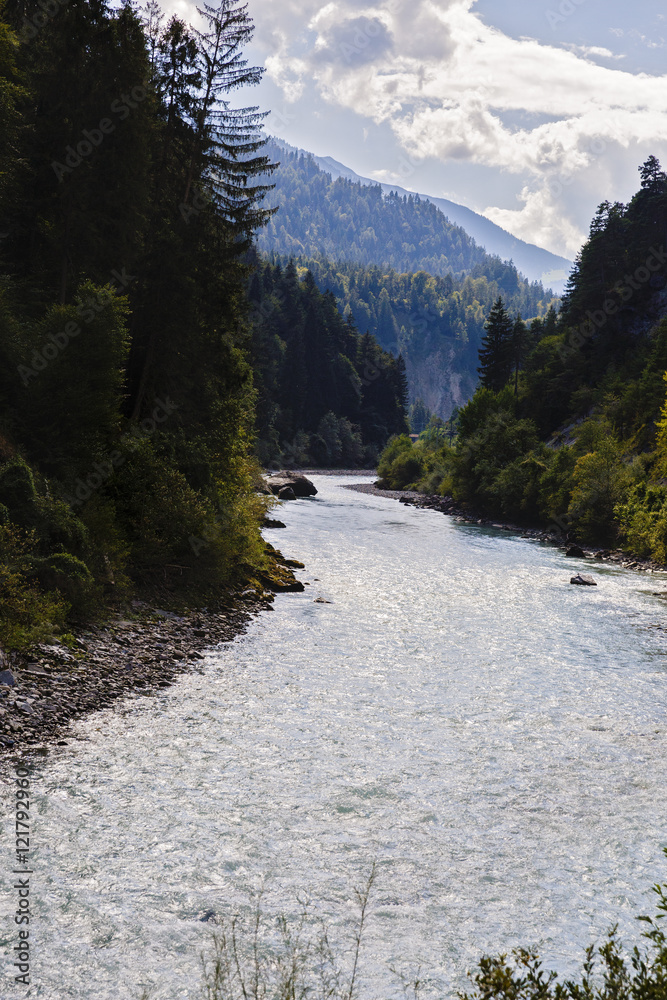 landscape with a beautiful mountain river in Alps