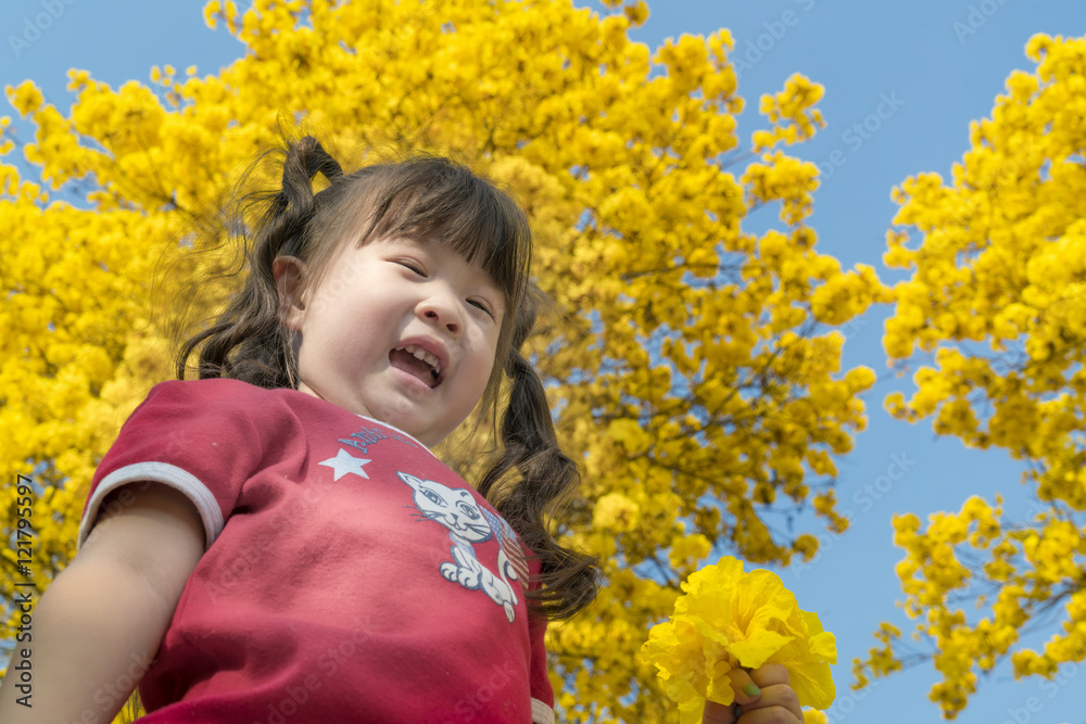 Beautiful little girl holding a flower in her hand Beautiful little girl holding a flower in her hand