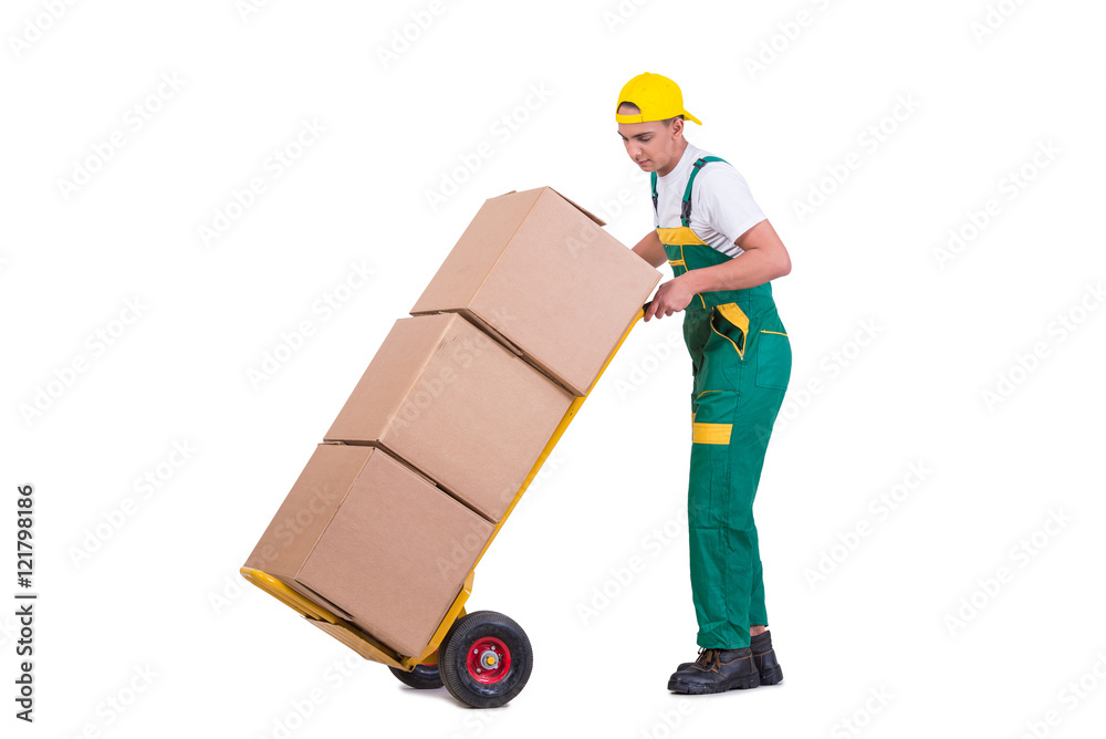Young man moving boxes with cart isolated on white