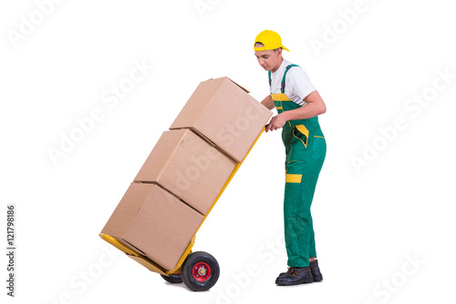 Young man moving boxes with cart isolated on white