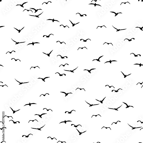 Seamless pattern of a flock of flying birds