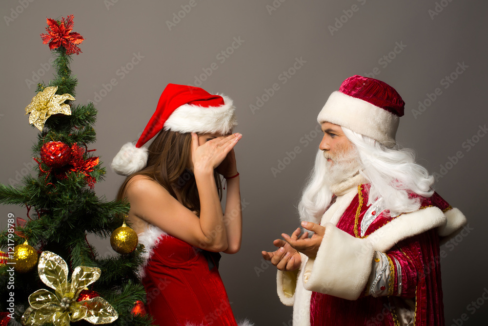 Shy pretty girl and santa