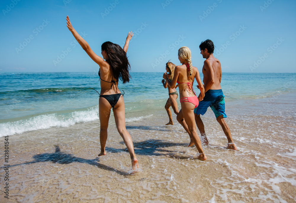 Active people having fun on the beach