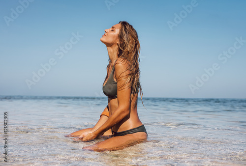 Young woman relaxing in sea water