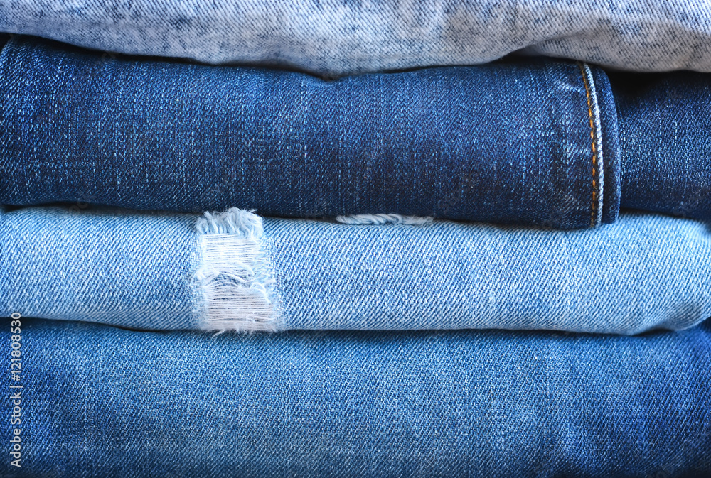 Fashionable and stylish clothes - a lot of different blue jeans