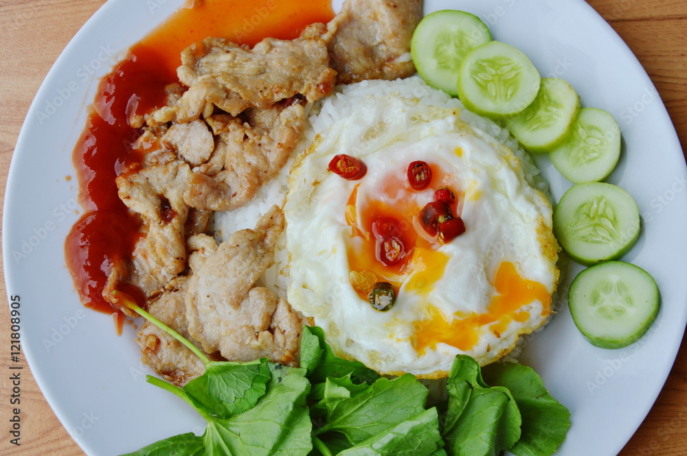 fried pork with garlic and pepper topping creamy egg yolk on rice fried pork with garlic and pepper topping creamy egg yolk on rice