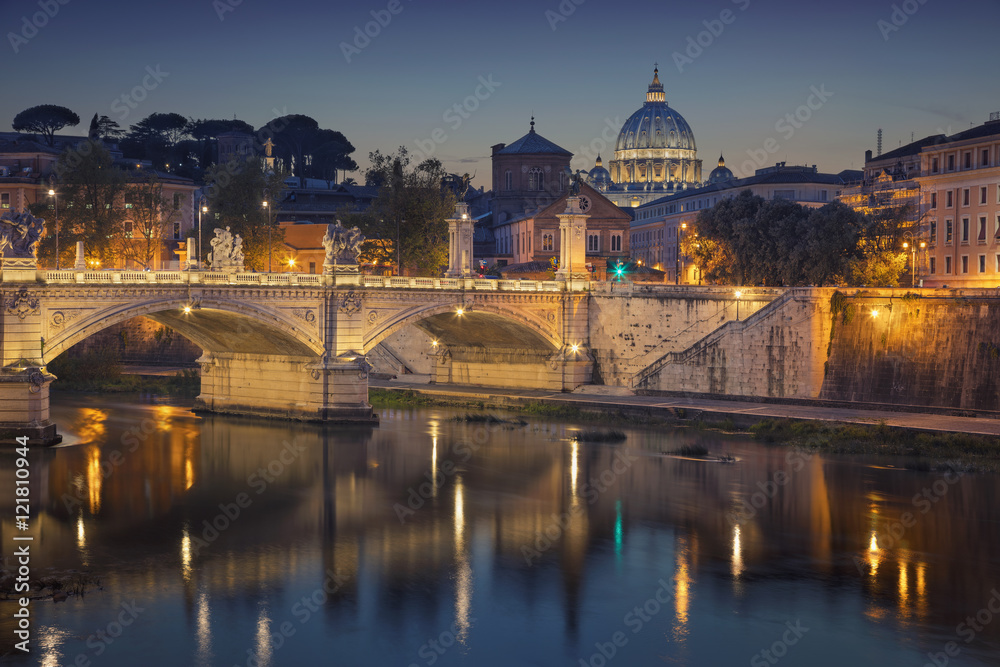 Rome. View of Vittorio Emanuele Bridge and the St. Peter's cathedral in Rome, Italy at night.