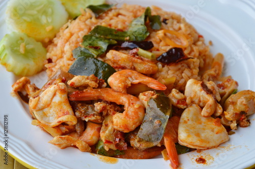 spicy fried rice with seafood and spice on dish