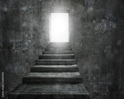 Open door with bright light and old dirty concrete stairs