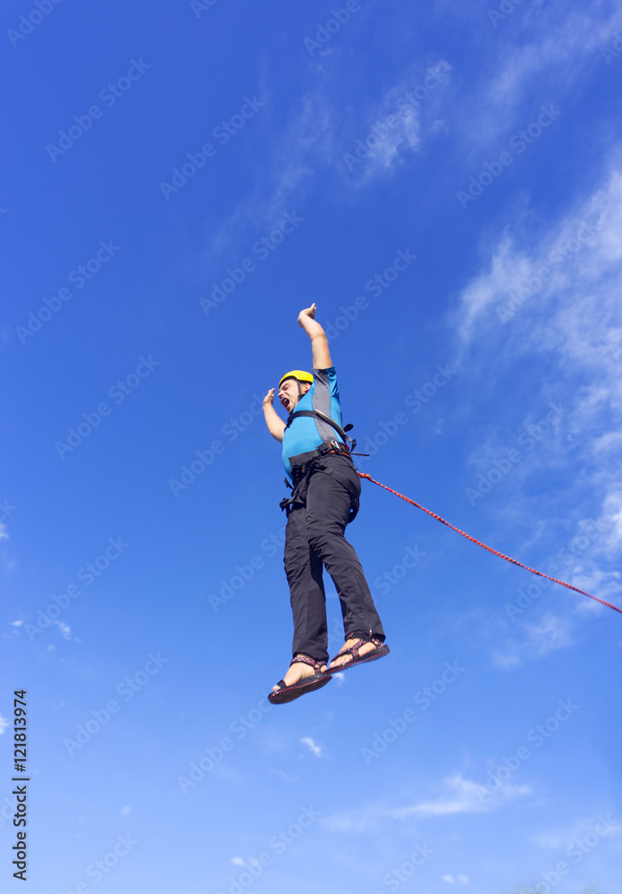 Jump rope from a high rock in the mountains. Jump rope from a high rock in the mountains.