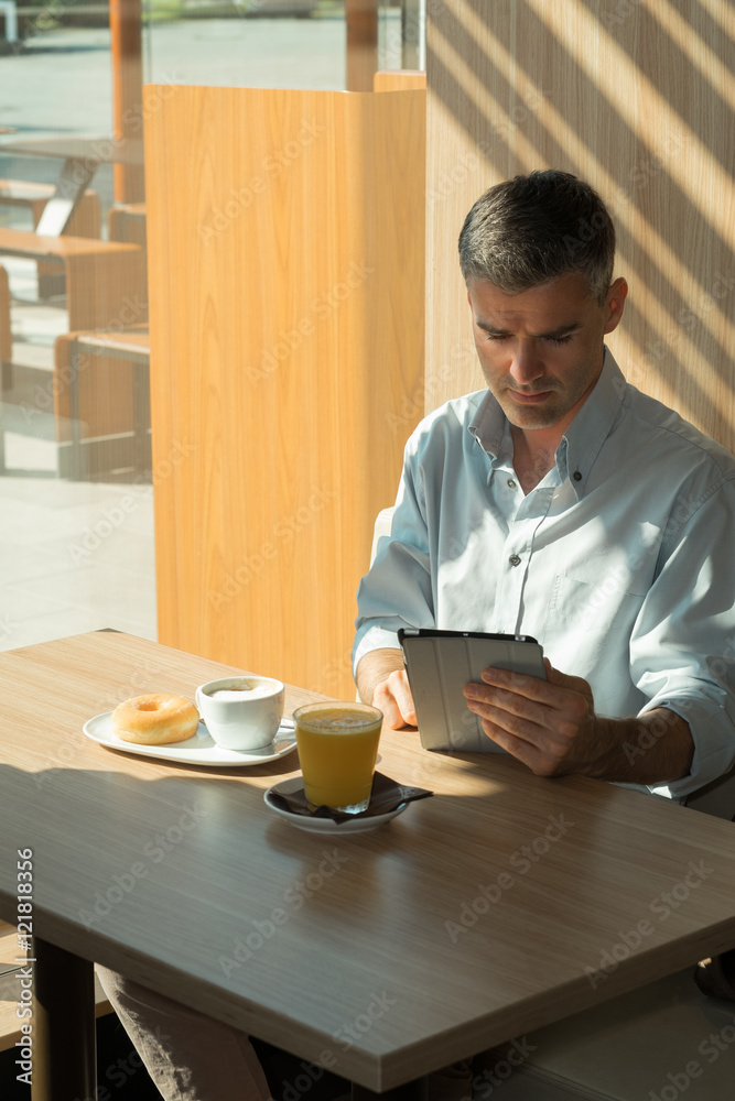 Businessman relaxing at the cafe Businessman relaxing at the cafe