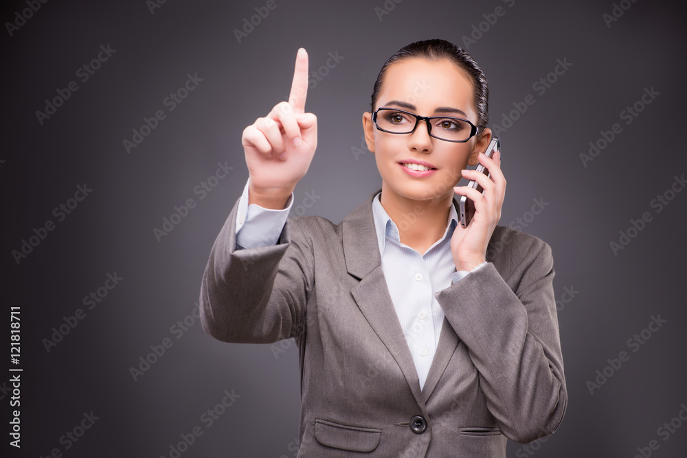 Businesswoman pressing virtual buttons in business concept Businesswoman pressing virtual buttons in business concept