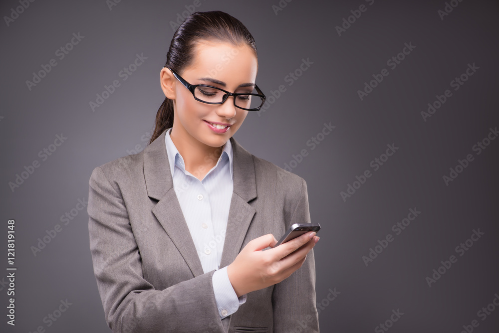 Businesswoman texting and sending text messages Businesswoman texting and sending text messages