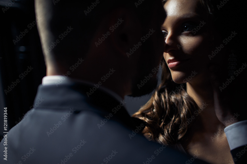 Romantic moment of the lovely couple in the dark room Romantic moment of the lovely couple in the dark room