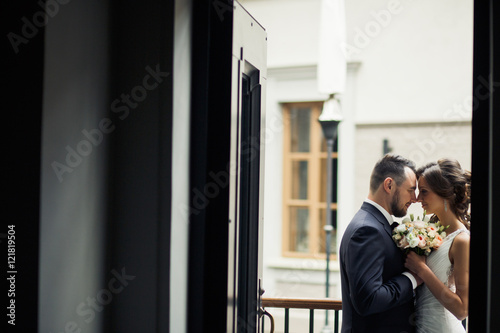 Young couple in love on the hotel's balcony