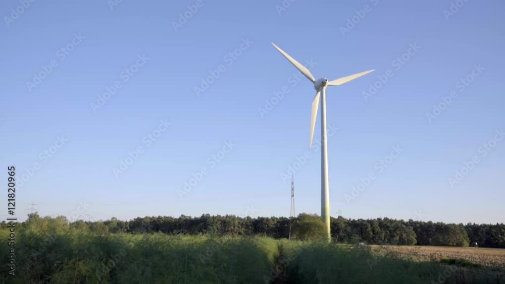 wind energy plant with powerline and green landscape wind energy plant with powerline and green landscape
