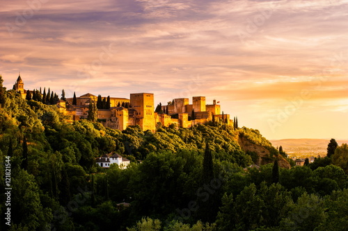 Beautiful sunset view of Spain's main tourist attraction, ancient arabic fortress of Alhambra, Granada, Spain