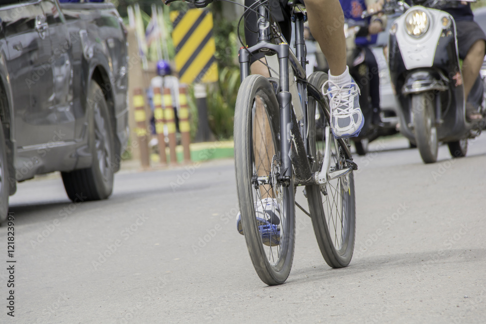 Foot of people are cycling on the road Foot of people are cycling on the road